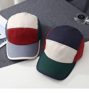 Detail of color-block 5-panel camping caps in canvas cotton with flat brim design