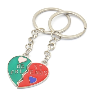 Detail of heart-shaped Best Friends keychains with green and red enamel finish