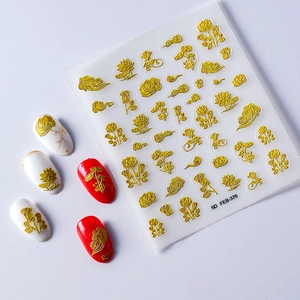 Detail of 5D gold embossed rose nail stickers showing metallic 3D floral textures
