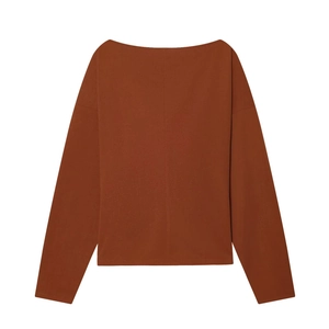 Detail of tan off-the-shoulder long sleeve top with fine stitching and ribbed texture