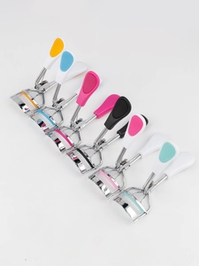 Close-up of colorful ergonomic handles on stainless steel mini eyelash curlers set