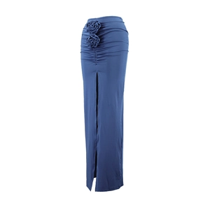 Detailed view of elegant blue maxi skirt with 3D floral accents and high side slit