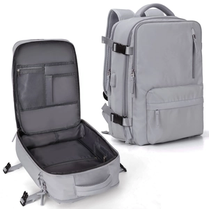 Detailed macro view showing the internal compartments and outer design of the grey nylon backpack