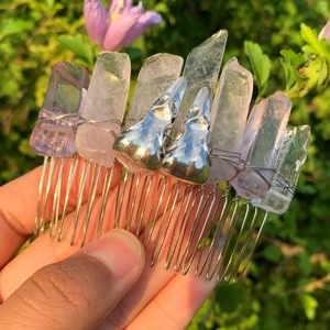 Detail of handmade hair comb with rose crystal columns and silver bird skull elements