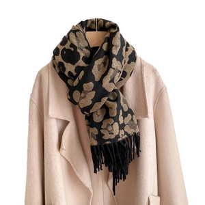 Classic leopard print cashmere shawl scarf with fringes over a wool coat for winter