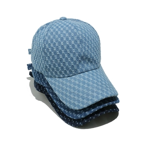 Three washed denim baseball caps with diamond distressed patterns in blue shades