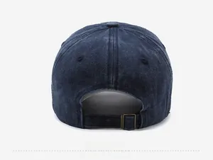 Detailed back view of vintage washed denim baseball cap with adjustable bronze metal buckle