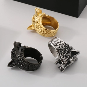 Detailed view of wolf head rings in gold, black, and silver vintage stainless steel