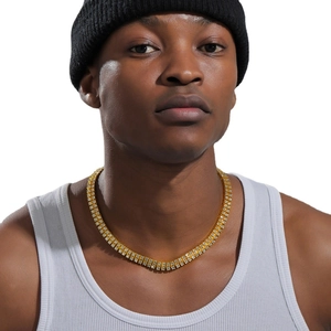 Men's golden double-row rhinestone tennis chain necklace worn by model on white background