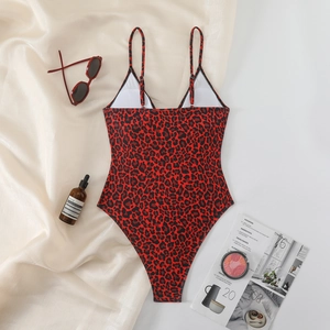Flat lay of red leopard print one-piece swimsuit with V-neck and thin straps design