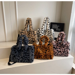 Detailed display of plush leopard print tote bags in five various trendy color options