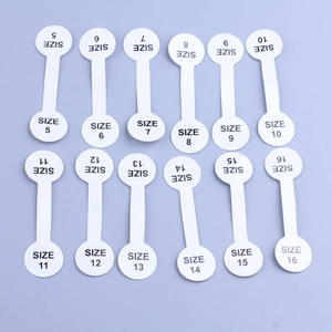 Self-adhesive white size labels for rings and jewelry from size 5 to 16 displayed in rows