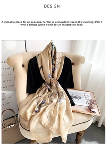 Detailed texture of champagne silk scarf with elegant floral prints on a French chair