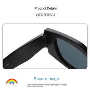 Detail view of reinforced metal hinge on black cat-eye kids sunglasses for durability