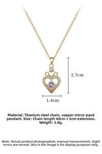 Detail of a hollow heart pendant with zircon inlay and golden titanium steel chain