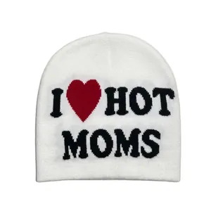 Detail shot of the white knitted beanie featuring I Love Hot Moms jacquard lettering