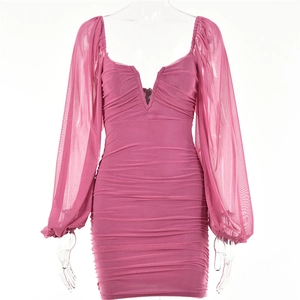 Detail of pink mesh mini dress featuring V-neckline, lantern sleeves and ruched texture