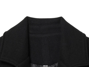 Close-up of the black wool blend coat collar featuring a small size S label
