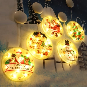 Christmas LED suction cup lights with Santa and snowman patterns in warm yellow glow