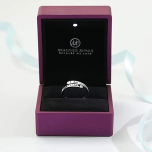 Detail view of S925 sterling silver I am enough ring in a premium LED lighted gift box