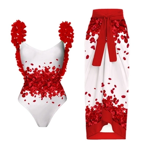 White one-piece swimsuit with red 3D floral petals and matching floral wrap skirt set