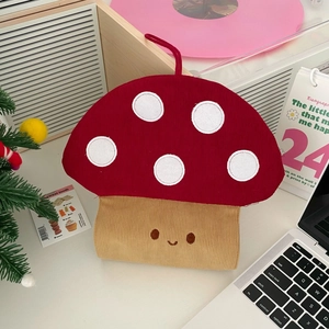 Detail of cute mushroom corduroy tissue case with smile embroidery on white desk