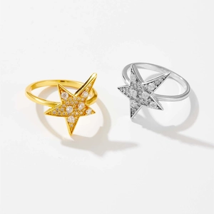 Detailed view of gold and silver S925 sterling silver rings with micro-pave star design