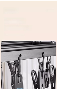 Detail of durable black multi-clip drying rack with high-strength spring mechanism