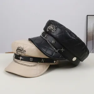 Detail of rivet and scorpion logo on quilted faux leather military flat top cap