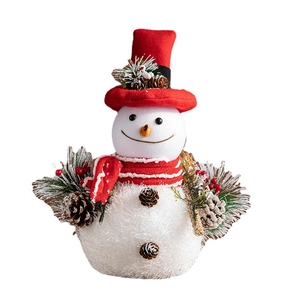 White foam Christmas snowman doll with red hat and scarf featuring pine cones and berries