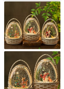 Detail of Santa Claus lantern with shimmering snow and LED light in a white basket base
