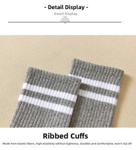 Close-up of grey and white striped knitted cuffs on high-elasticity crew socks
