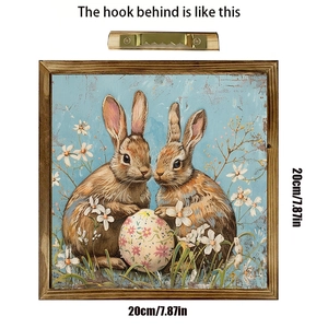 Detail of wooden Easter frame with sawtooth metal hanger for wall mounting and retro bunny art