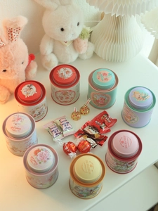 Macro shot of colorful bunny-themed tin tea canisters with double-lid moisture-proof design