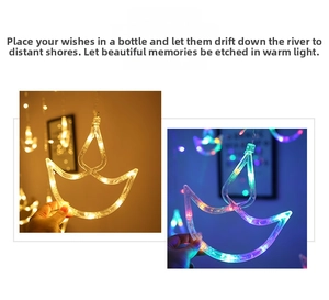 Detail of Diya-shaped LED curtain lights in warm white and multicolor for Diwali decoration