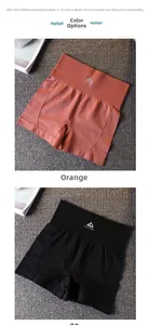 Détail du short de yoga sans couture taille haute en orange et noir avec taille côtelée
