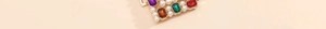 Detail of gold metal belt with colorful gemstones and pearls for party wear