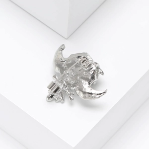 Detailed back view of silver owl brooch showing the secure needle clasp and metal texture