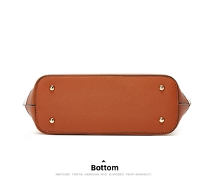 Detail of the brown Saffiano leather tote base with four protective golden metal studs