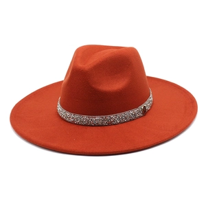 Orange cashmere felt jazz hat with rhinestone band and M logo on a white background