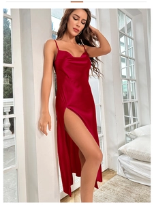 Detail of red satin slip dress with elegant cowl neck and high side slit feature
