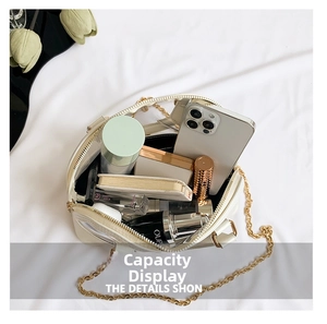 Internal view showing the spacious capacity of this transparent PVC shell bag with chain