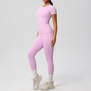 Detail shot of pink high-elastic yoga set showing seamless fit and breathable fabric
