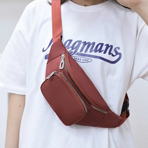 Waterproof burgundy nylon waist bag for women and men featuring a double zipper large capacity
