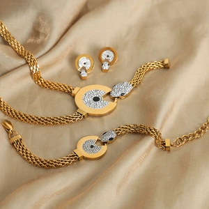 Gold-plated snake jewelry set with sparkling rhinestones including necklace and bracelet