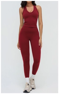 Front view of dark red high-waist yoga set with halter V-neck sports bra and leggings