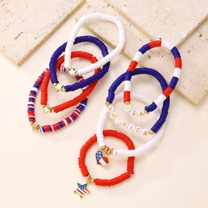 Close-up of USA America themed red white and blue beaded bracelets with charms