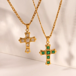 Gold Figaro chain necklaces featuring cross pendants with clear and green cubic zirconia