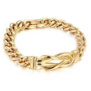 Macro detail of 18K gold plated hip-hop knot bracelet with Cuban chain texture