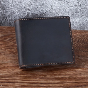 Deep brown crazy horse leather men's wallet on wooden table with sharp stitching